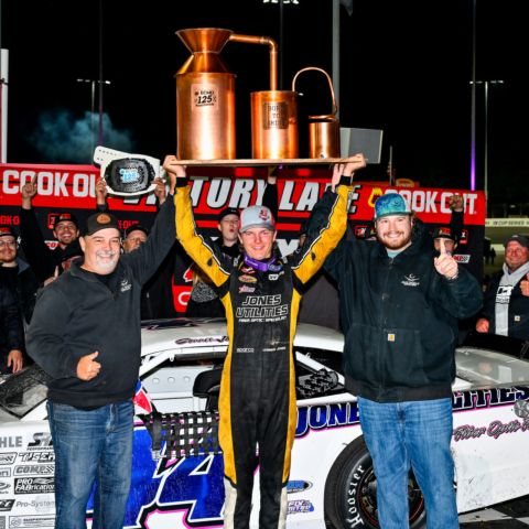 Conner Jones celebrates on Saturday after winning the ECMD 125 zMAX CARS Tour Late Model Stock Car race at North Wilkesboro Speedway. 