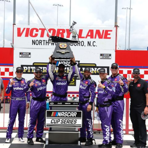 Members of Christopher Bell's No. 20 Joe Gibbs Racing pit crew celebrate their victory in the NASCAR Pit Crew Challenge presented by Mechanix Wear on Saturday at North Wilkesboro Speedway. 